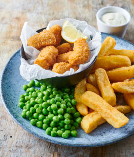 Lemon-breaded sole fish with French fries and peas