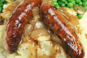Sausages with mashed potatoes and onion sauce