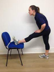 Hamstring stretch with the leg resting on a chair